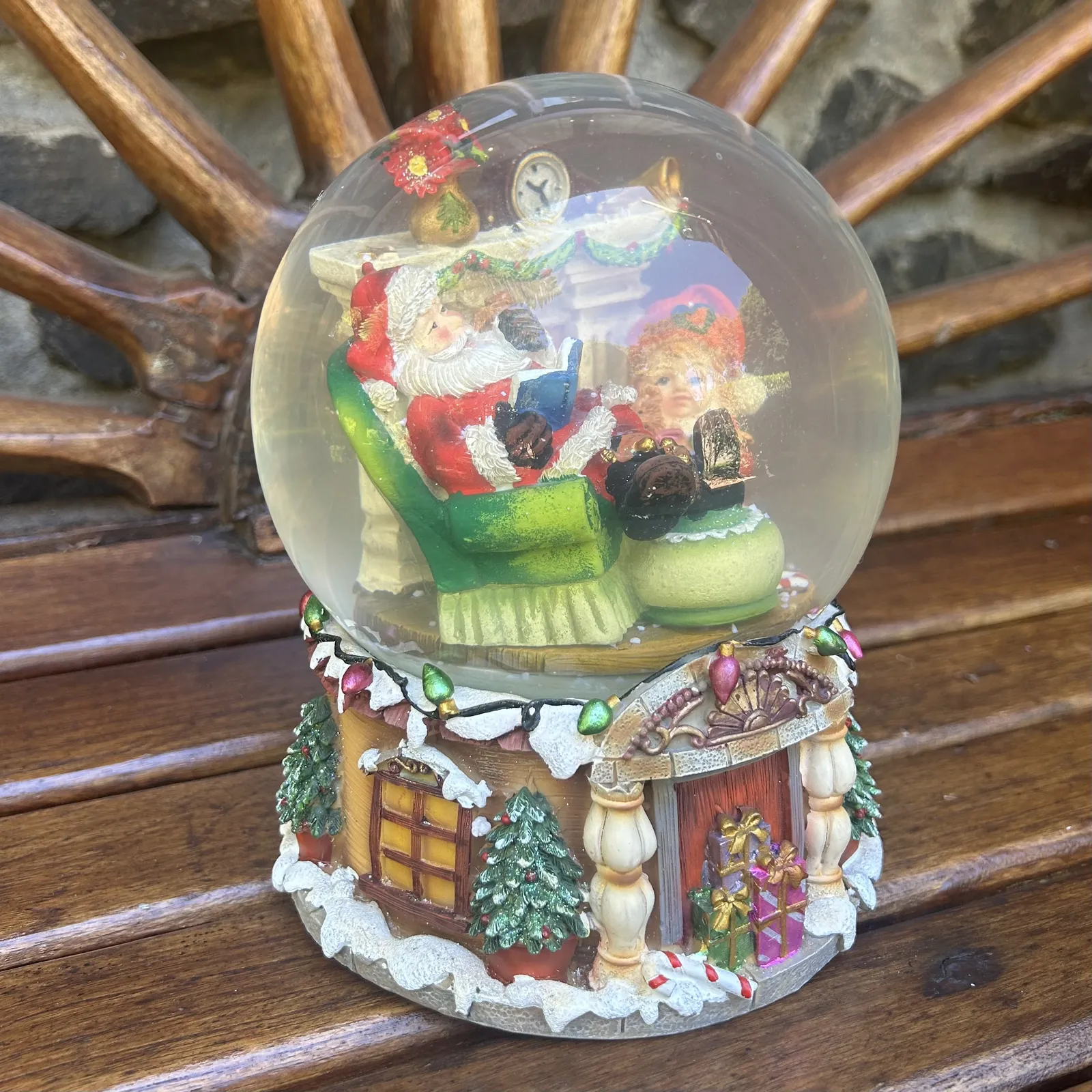 20cm Musical Snow Globe With Santa In Armchair - We Wish You A Merry Christmas (Discoloured Liquid) image