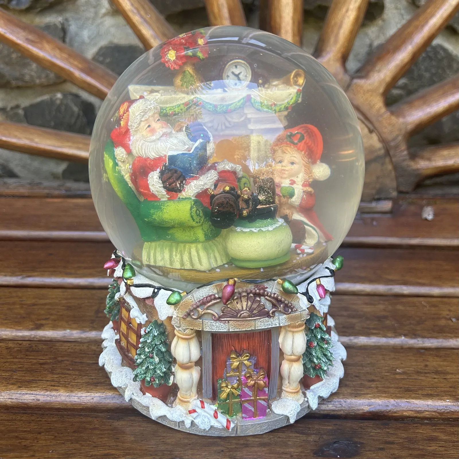 20cm Musical Snow Globe With Santa In Armchair - We Wish You A Merry Christmas (Discoloured Liquid) image