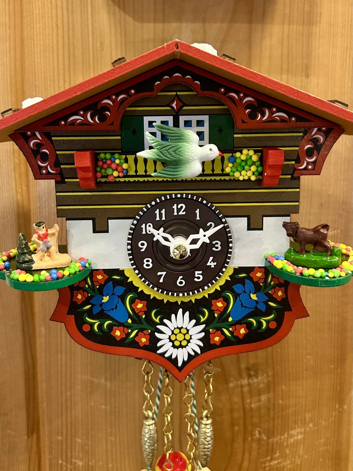Swiss House Battery Chalet Clock With Swinging Doll 14cm By TRENKLE (Green Bird) image
