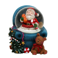 5cm Santa In Armchair Snow Globe- Assorted Designs image