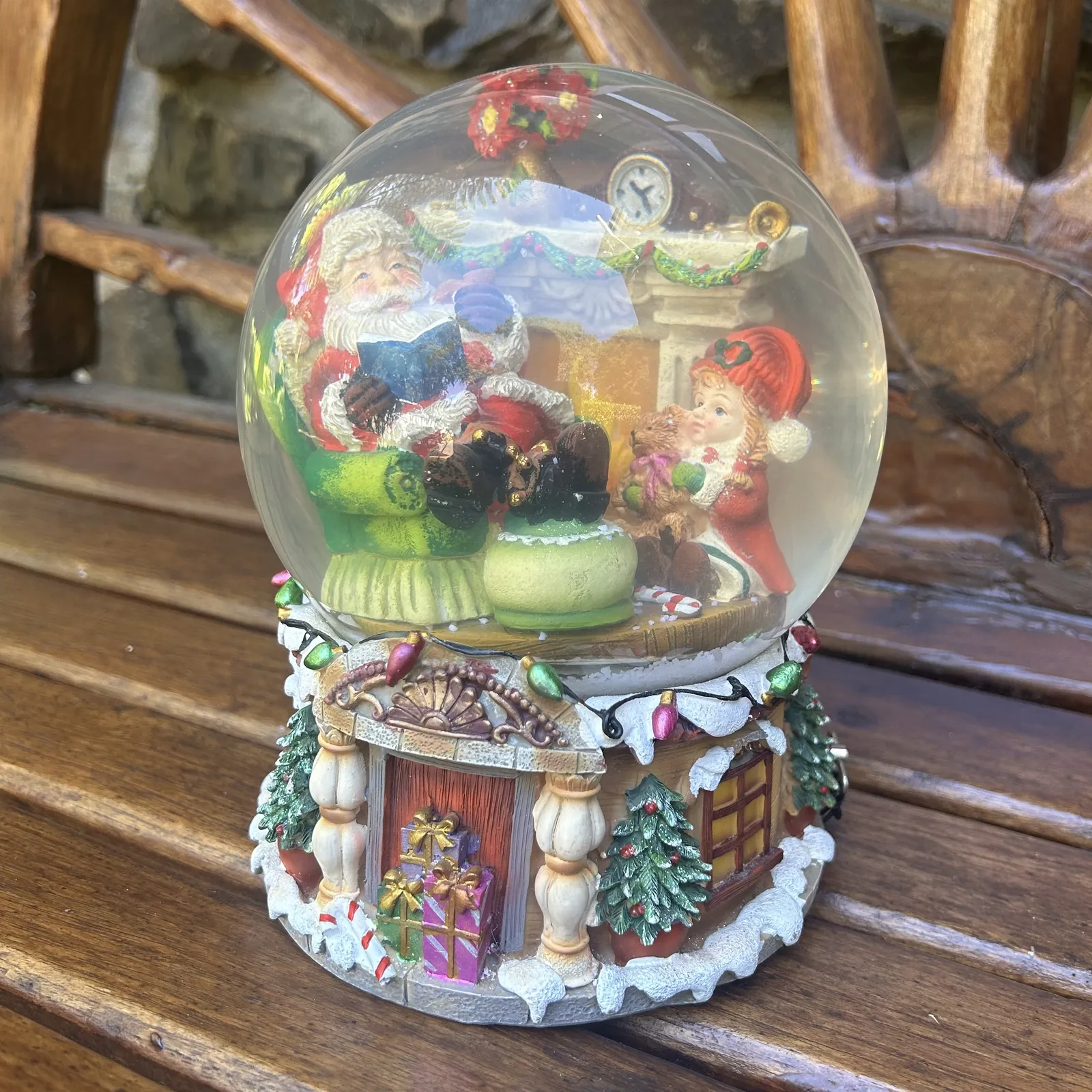 20cm Musical Snow Globe With Santa In Armchair - We Wish You A Merry Christmas (Discoloured Liquid) image