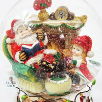 20cm Musical Snow Globe With Santa In Armchair (We Wish You A Merry Christmas) image