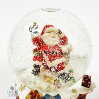 14.5cm Musical Snow Globe With Santa On Chimney (We Wish You a Merry Christmas) image