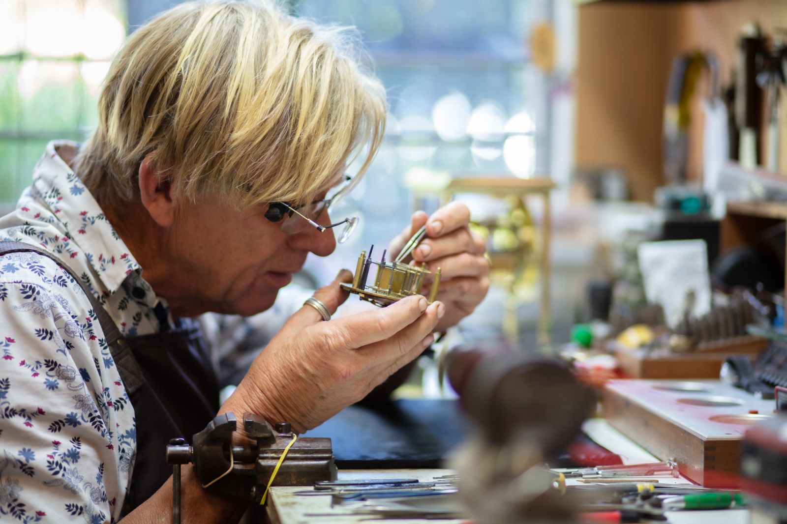 Bruce Davis repairing a clock