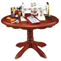 MINIATURE SEWING MACHINE ON TABLE