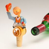 Carved Bottle Stopper Man On Wine Barrell